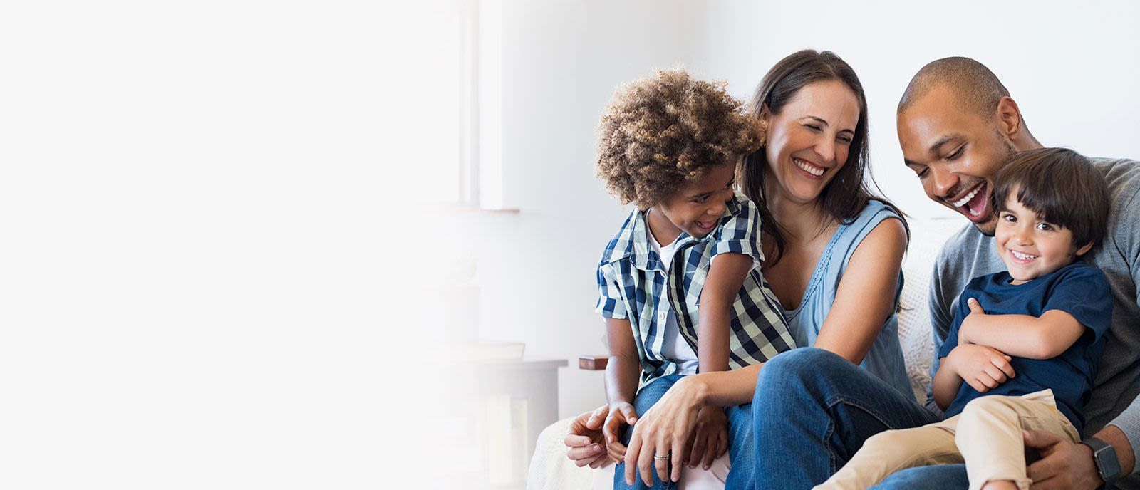 A family relaxing together at home, smiling
